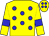Yellow body, blue spots, yellow arms, blue armlets, yellow cap, blue spots