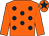 Orange, dark blue spots, orange sleeves, orange cap, dark blue star